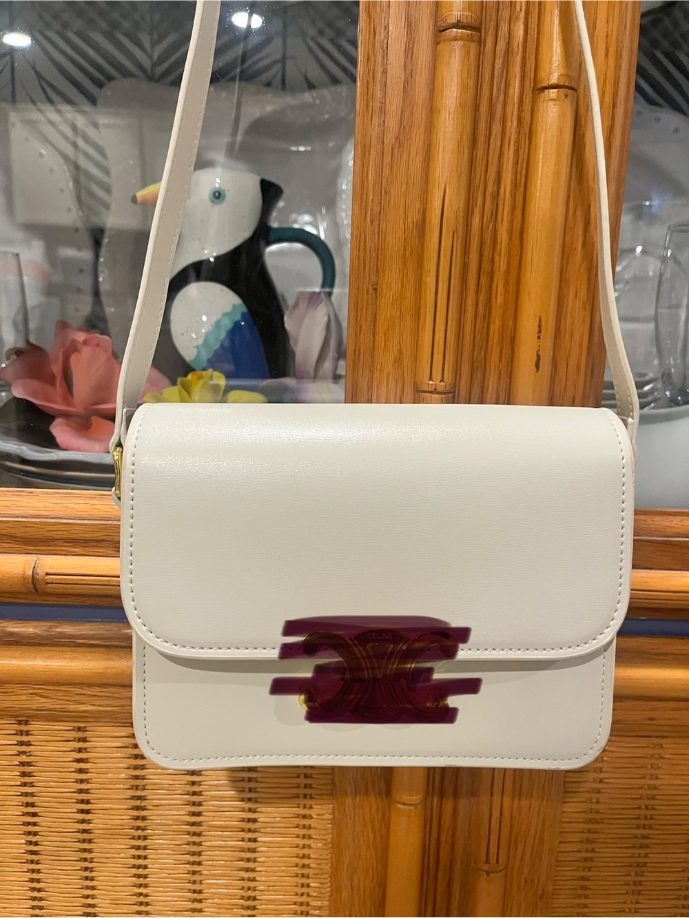 White Leather Crossbody Bag with gold emblem and hardware